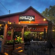 Molly's in St Boni Outdoor Patio photo taken at dusk showing seating and lights