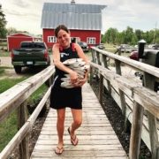 Molly Krinhop carrying a load of dishes